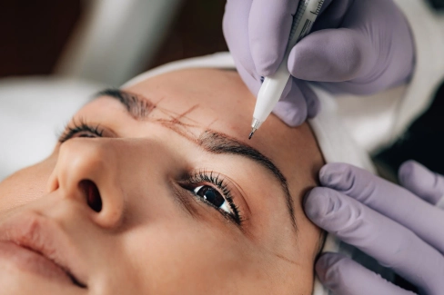 professional microblading of eyebrows red